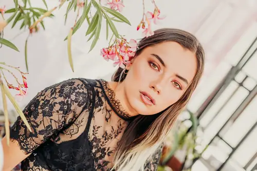 MYSTICA — portrait with flowers, luminous skin and black lace