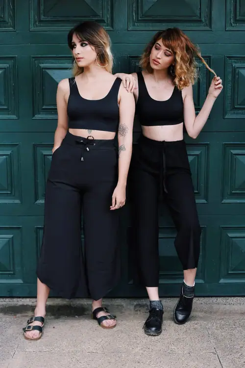 MYSTICA — pair of black sets against a green door