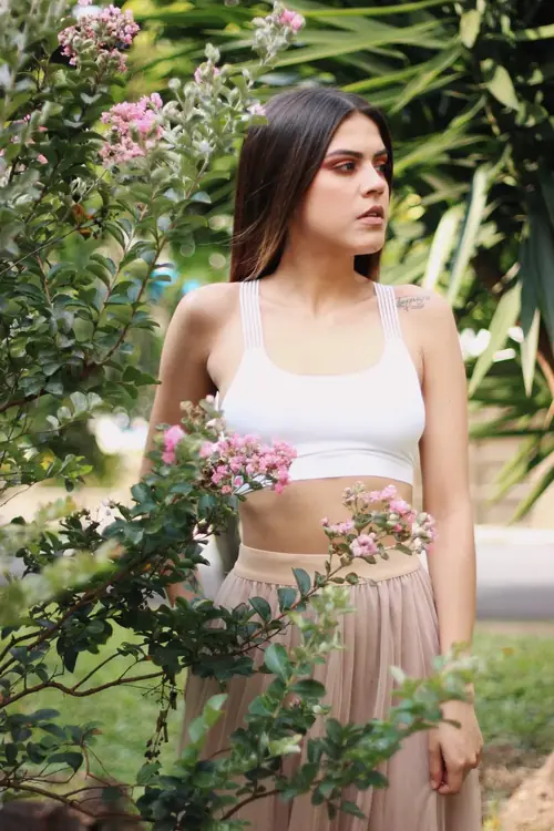 MYSTICA — white top and tulle skirt among flowers